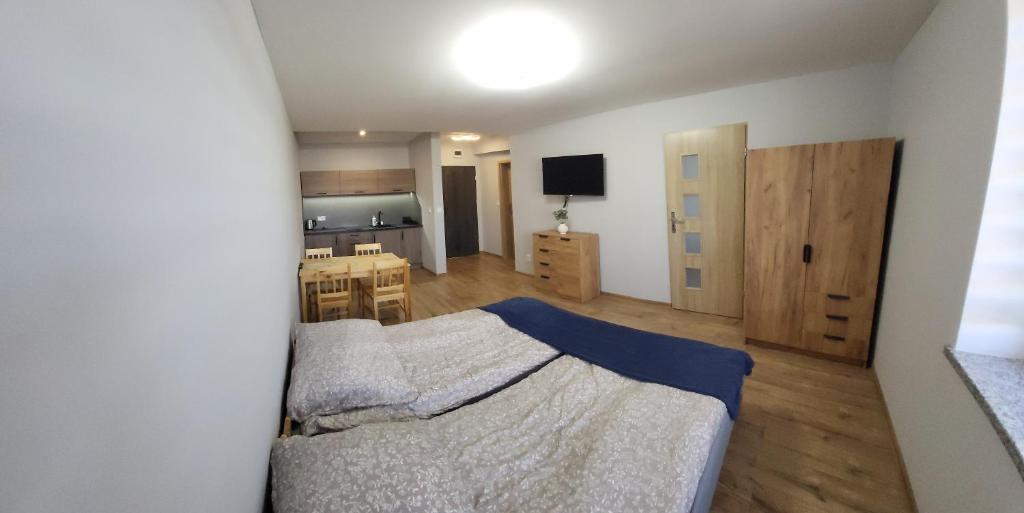 En eller flere senge i et værelse på ApartHotel11