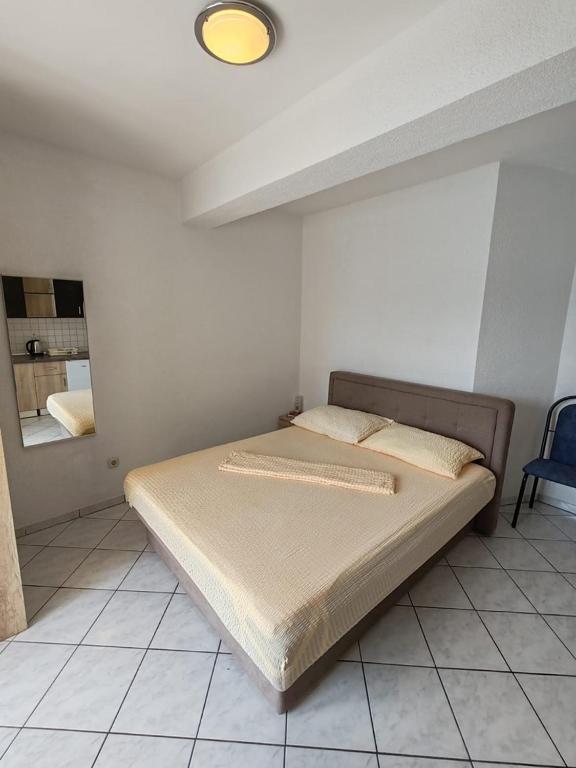 Postel nebo postele na pokoji v ubytování Villa Raguž sa Privatnom plažom i Garažom