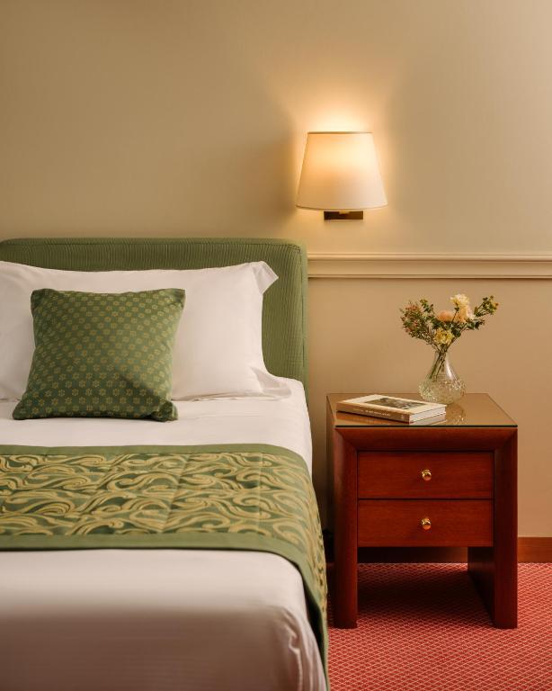 Postel nebo postele na pokoji v ubytování Hotel Barchetta Excelsior