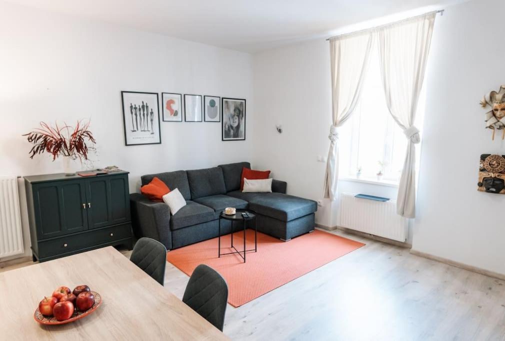 a living room with a couch and a table at Oldie goldie in Maribor