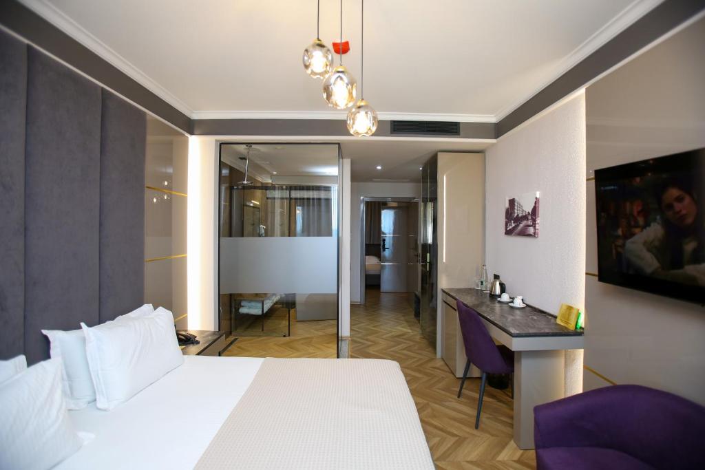 Postel nebo postele na pokoji v ubytování Belvedere Hotel & SPA
