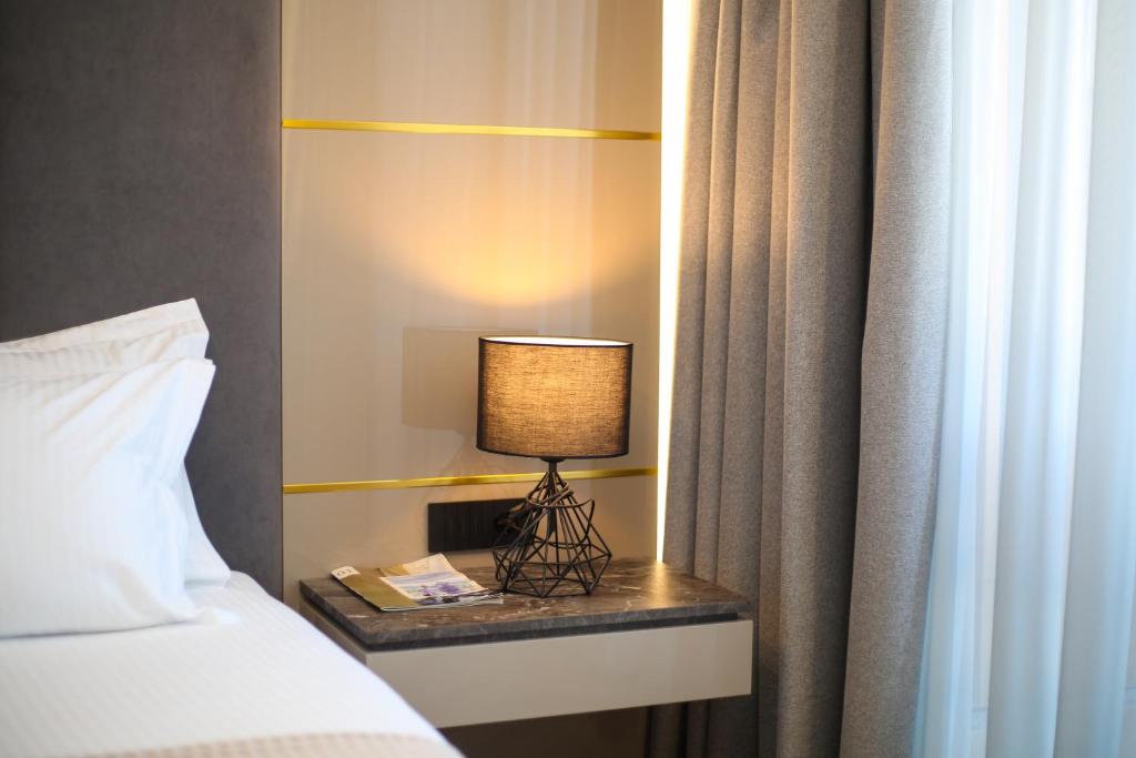 Postel nebo postele na pokoji v ubytování Belvedere Hotel & SPA