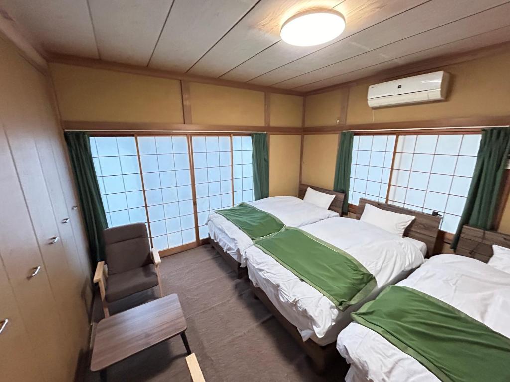 Postel nebo postele na pokoji v ubytování Ocean villa 大洗
