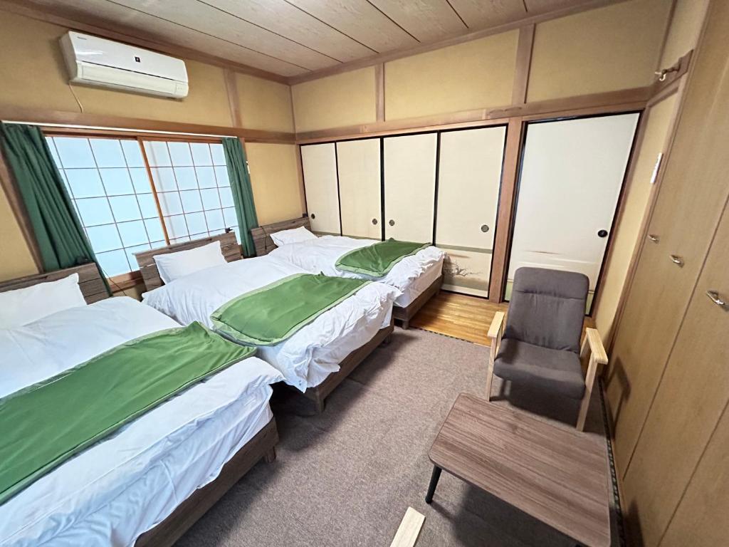 Postel nebo postele na pokoji v ubytování Ocean villa 大洗