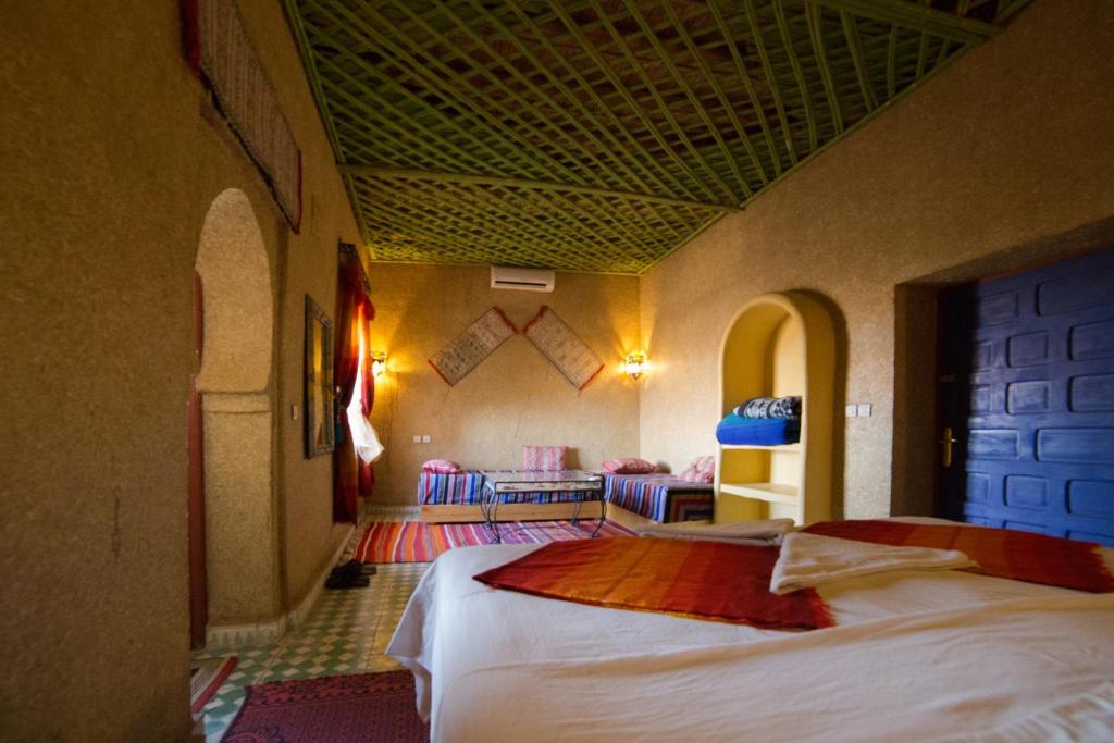 Postel nebo postele na pokoji v ubytování Kasbah Hotel Panorama