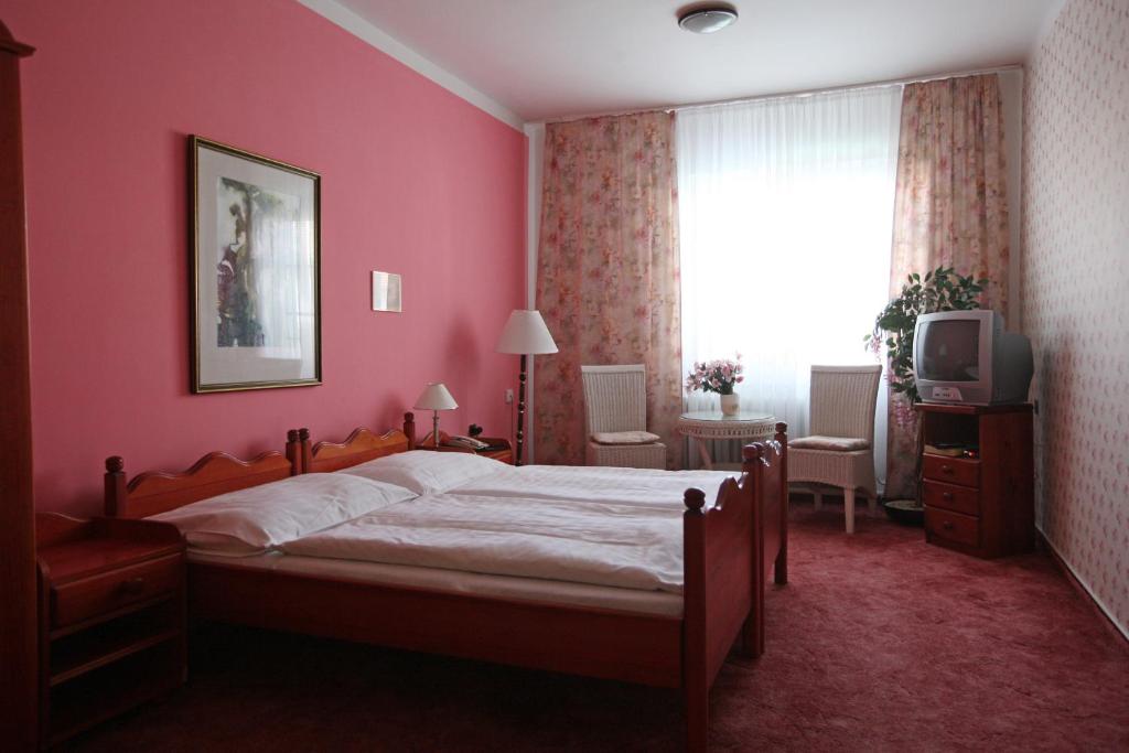 Postel nebo postele na pokoji v ubytování Hotel Solaster Garni