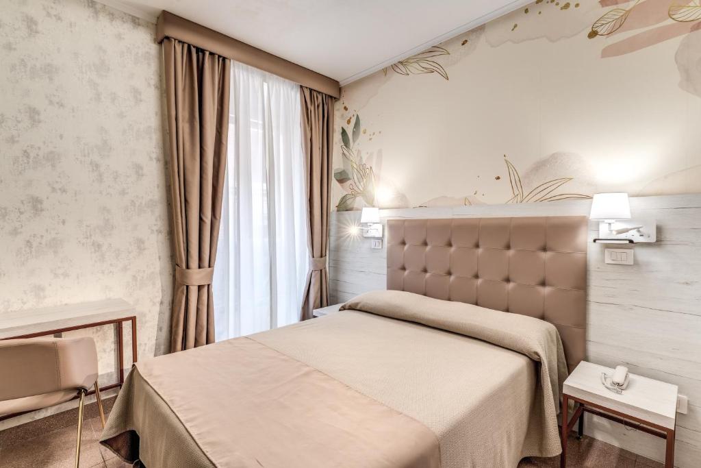 Postel nebo postele na pokoji v ubytování Hotel Milo