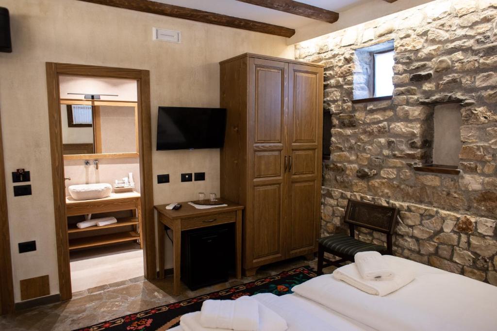Postel nebo postele na pokoji v ubytování Vista Boutique Hotel
