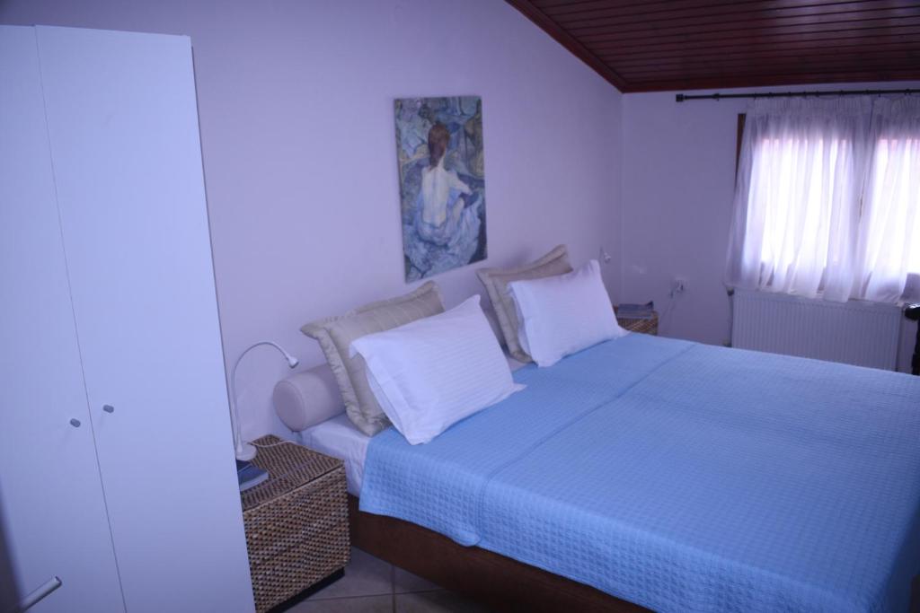 Postel nebo postele na pokoji v ubytování Kallikratia Holiday Flat 1