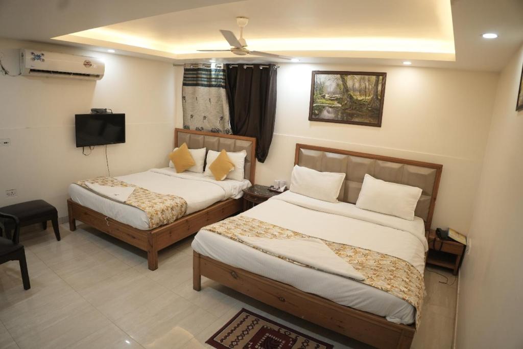 Ένα ή περισσότερα κρεβάτια σε δωμάτιο στο Airport hotel ROYAL RESIDENCY