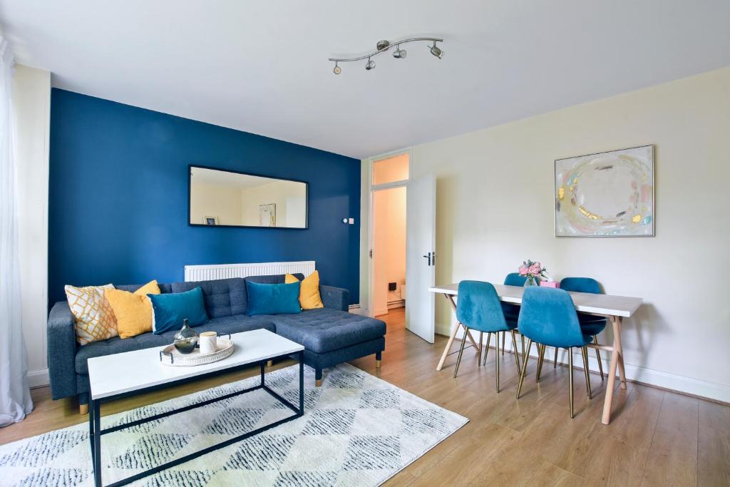 a living room with a couch and a table at 3 Beds apartments, Family Friendly In Central London in London