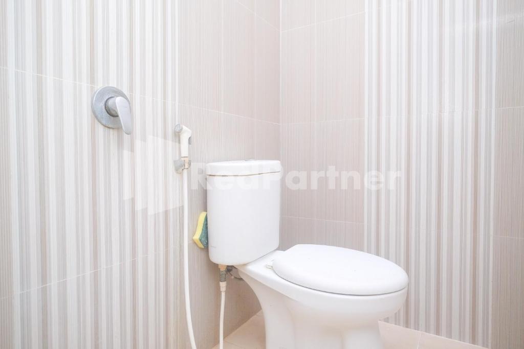 Koupelna v ubytování Tatti Inn Syariah Seturan RedPartner