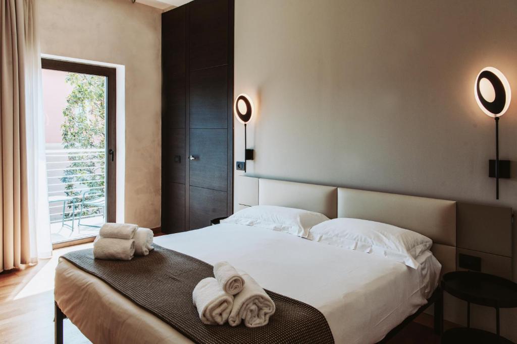 Postel nebo postele na pokoji v ubytování AQVA Boutique Hotel (Adults Only)