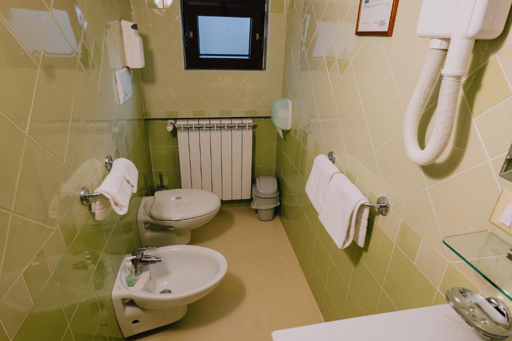 Koupelna v ubytování Hotel Nilde