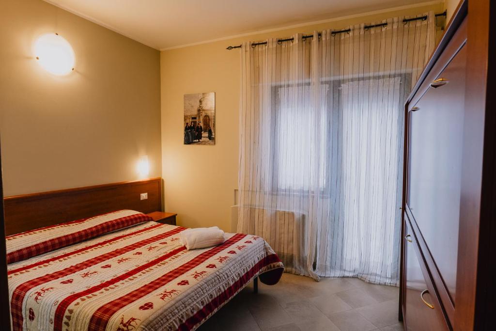 Postel nebo postele na pokoji v ubytování Hotel Nilde