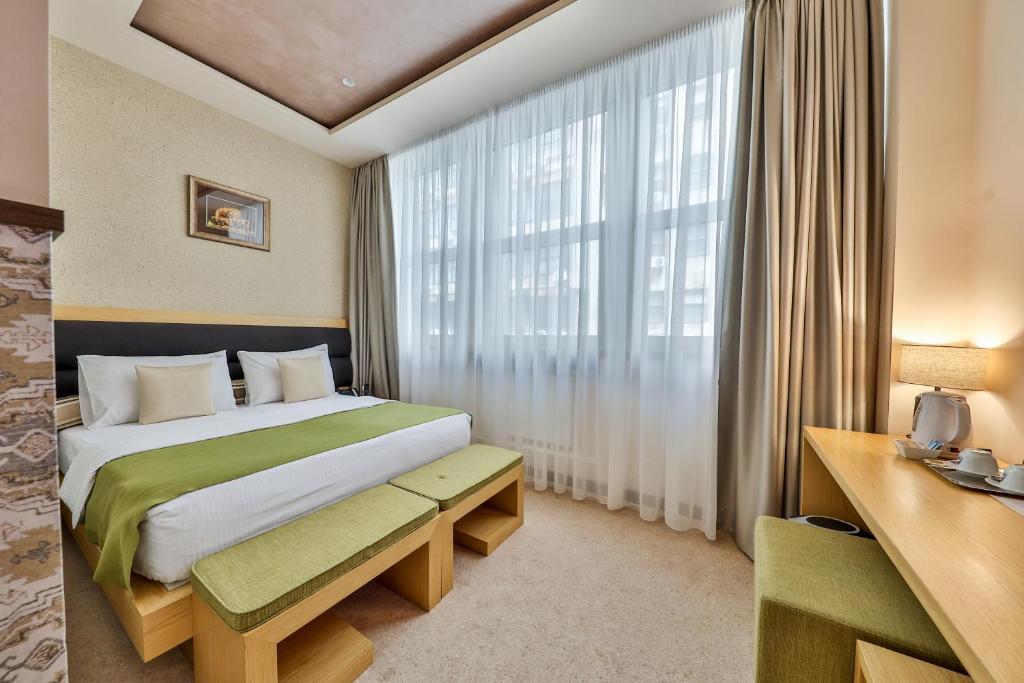 Postel nebo postele na pokoji v ubytování Atera Business Suites