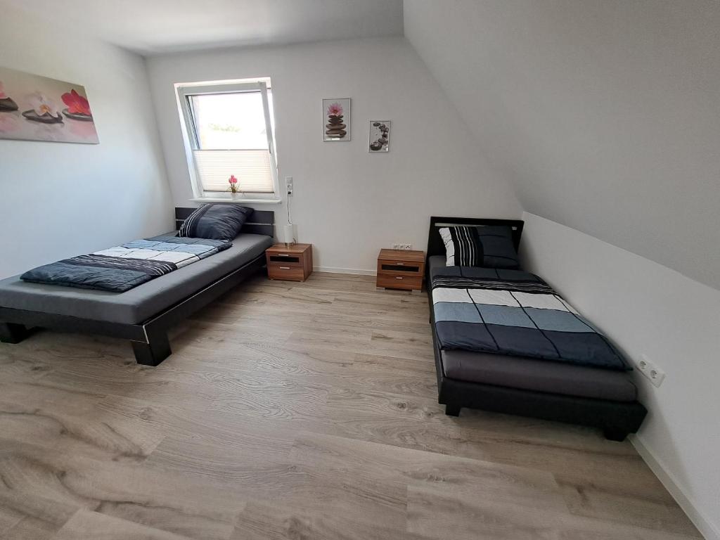 Postel nebo postele na pokoji v ubytování FeWo am Obenende
