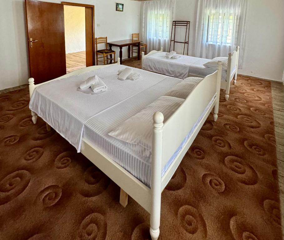 Postel nebo postele na pokoji v ubytování Guest House Noku