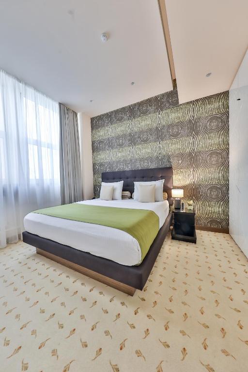 Postel nebo postele na pokoji v ubytování Atera Business Suites