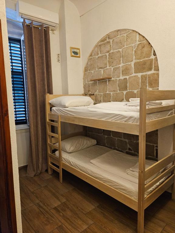 Postel nebo postele na pokoji v ubytování Castello Hostel