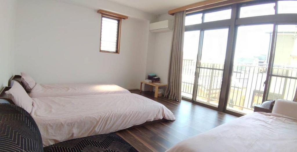 Postel nebo postele na pokoji v ubytování Guest House WA