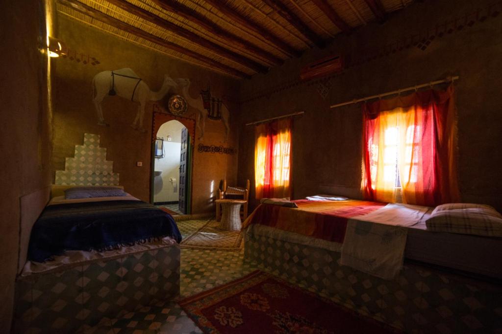 Postel nebo postele na pokoji v ubytování Kasbah Hotel Panorama