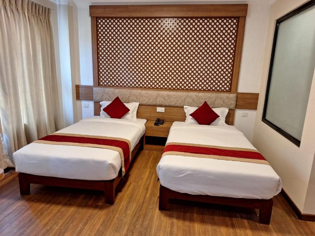 Postel nebo postele na pokoji v ubytování Hotel Himalayan Villa