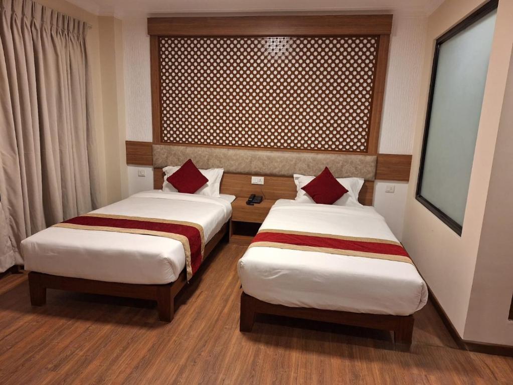 Postel nebo postele na pokoji v ubytování Hotel Himalayan Villa