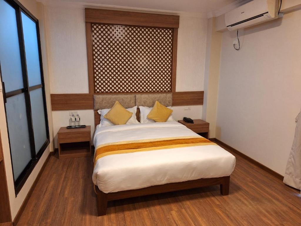 Postel nebo postele na pokoji v ubytování Hotel Himalayan Villa