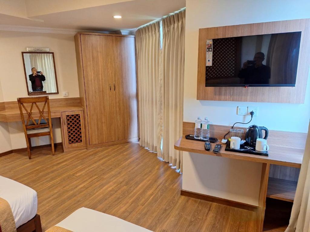 Postel nebo postele na pokoji v ubytování Hotel Himalayan Villa