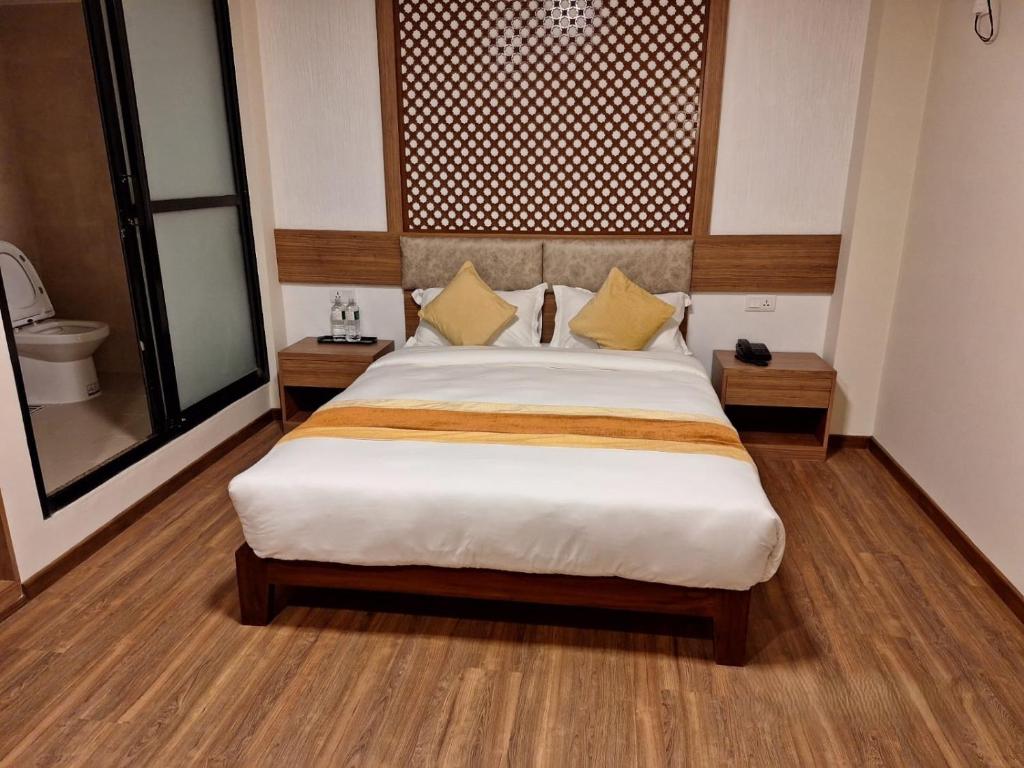 Postel nebo postele na pokoji v ubytování Hotel Himalayan Villa