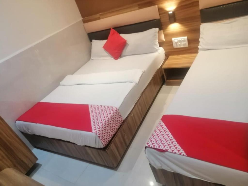Postel nebo postele na pokoji v ubytování Ruby Hotel