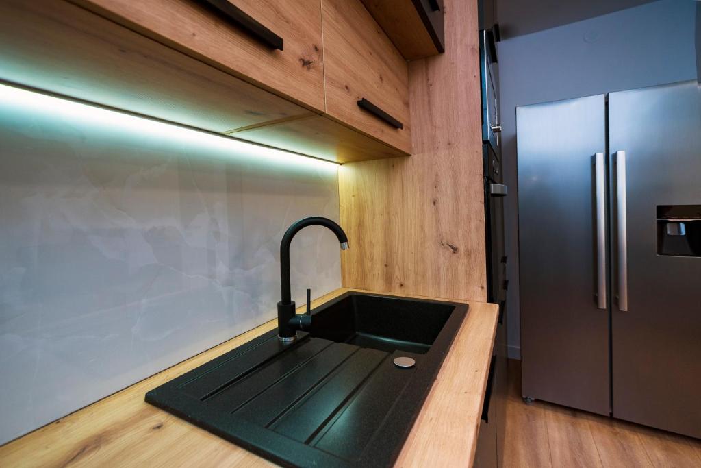 Kuchyňa alebo kuchynka v ubytovaní M&M Pelivan apartments