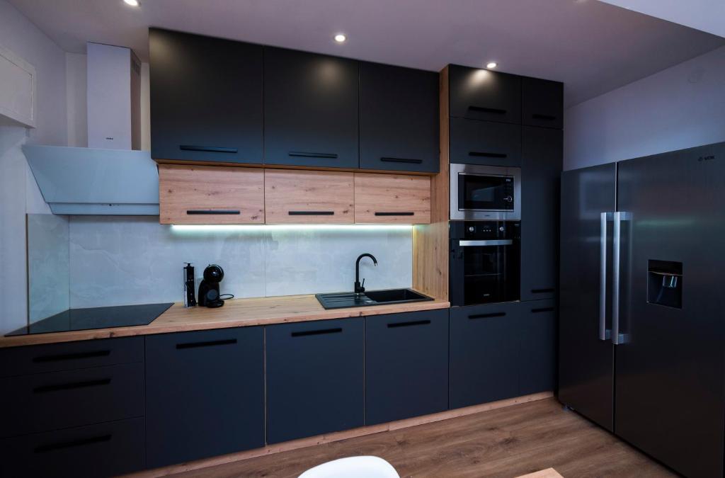 Kuchyňa alebo kuchynka v ubytovaní M&M Pelivan apartments