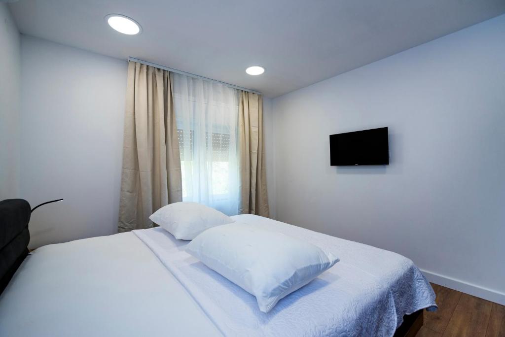 Posteľ alebo postele v izbe v ubytovaní M&M Pelivan apartments