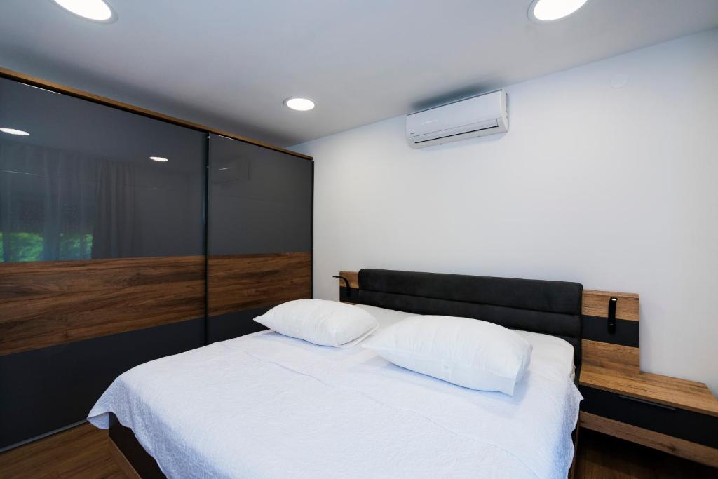 Posteľ alebo postele v izbe v ubytovaní M&M Pelivan apartments