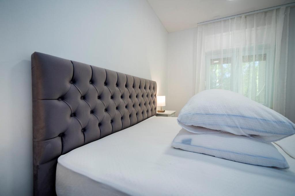 Posteľ alebo postele v izbe v ubytovaní M&M Pelivan apartments