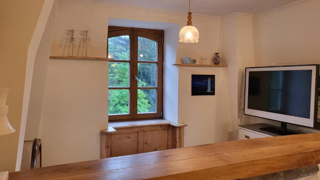 TV a/nebo společenská místnost v ubytování Charme studio