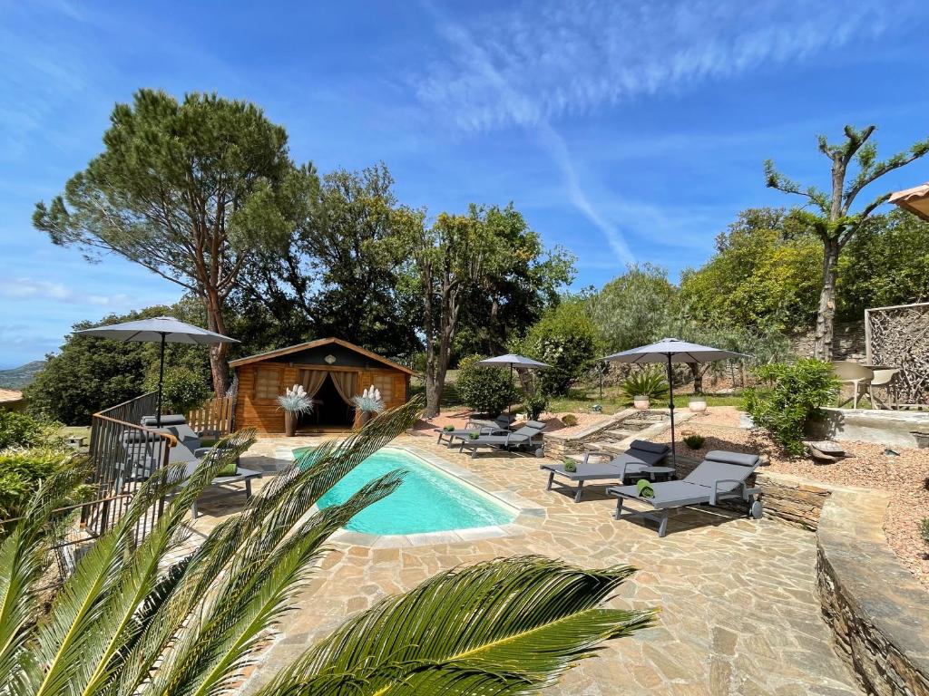 a villa with a pool and a house at Carpediem_corsica in Poggio-dʼOletta