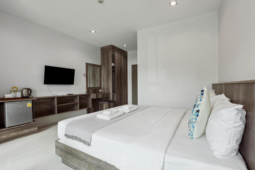 Postel nebo postele na pokoji v ubytování De Piraya residence