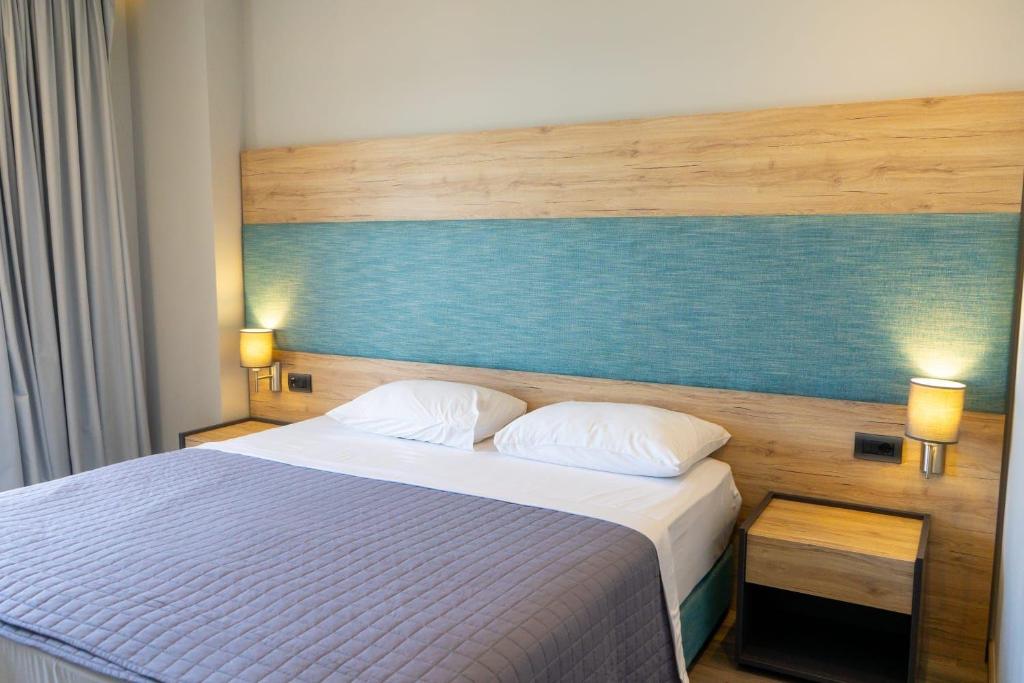 Postel nebo postele na pokoji v ubytování Hotel Saranda International