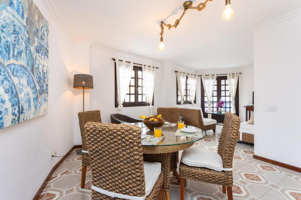 a dining room with a table and chairs at OkStay Apt Bencomo 50 m from the beach in Puerto de la Cruz