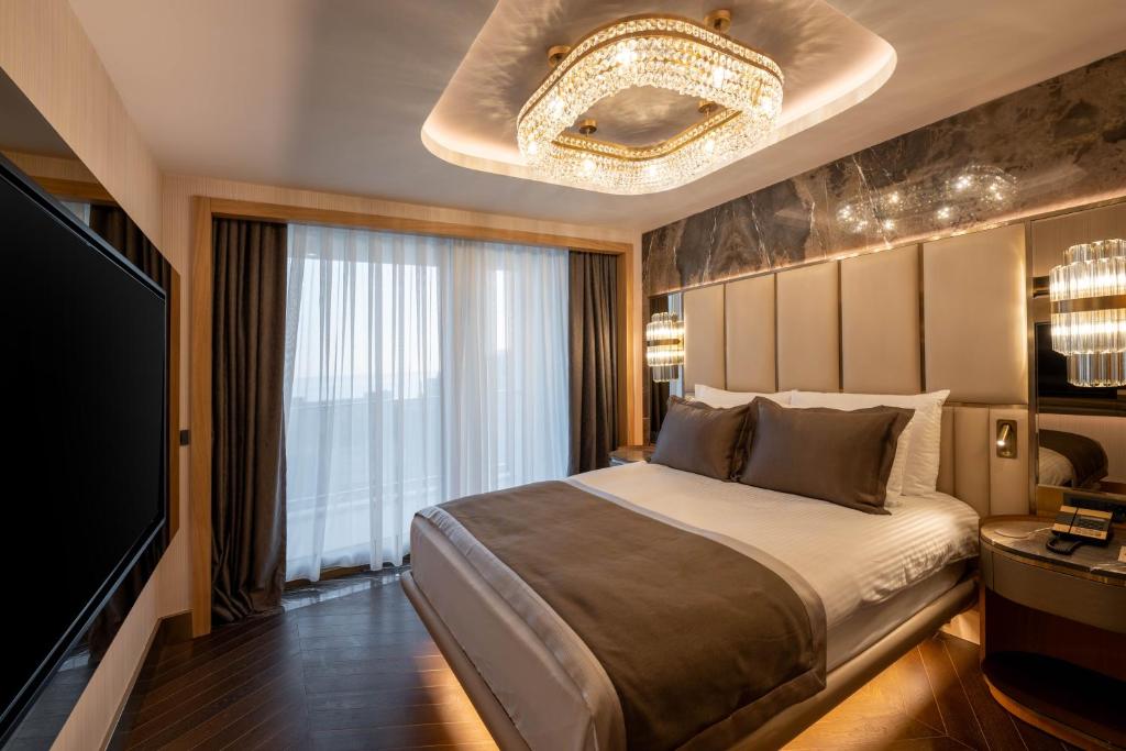 Postel nebo postele na pokoji v ubytování Merit Starlit Hotel & Residences