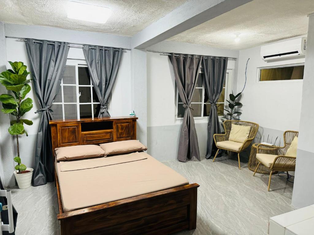 a bedroom with a bed in a room at The SD Apartment in Camiling