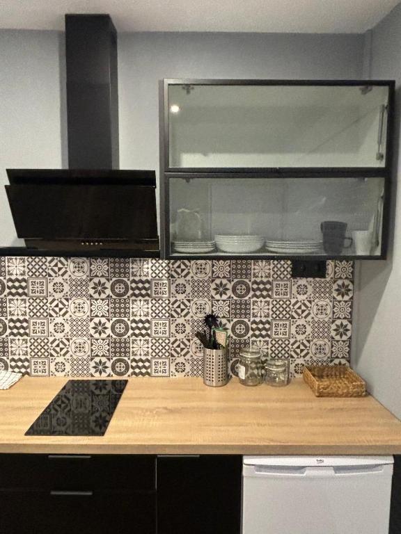 Kuchyň nebo kuchyňský kout v ubytování NOARU Apartamentos
