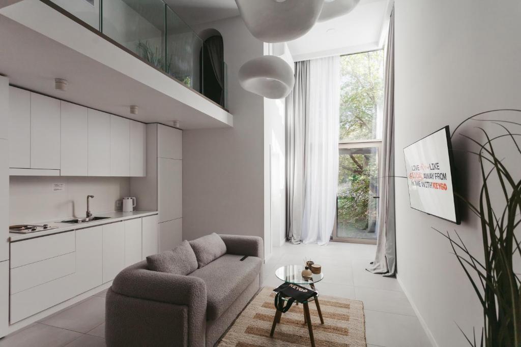 a living room with a couch and a table at Apartment KeyGo #0017 is the key to the center of Yerevan in Yerevan