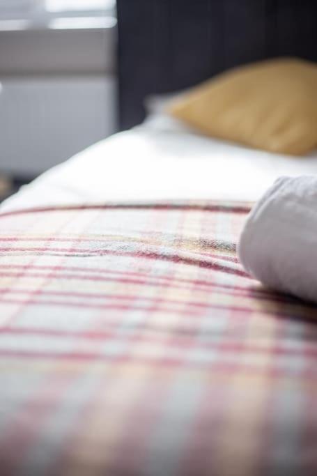 a close up of a bed with a mouse on it at Coastal Haven in Leigh-on-Sea in Southend-on-Sea