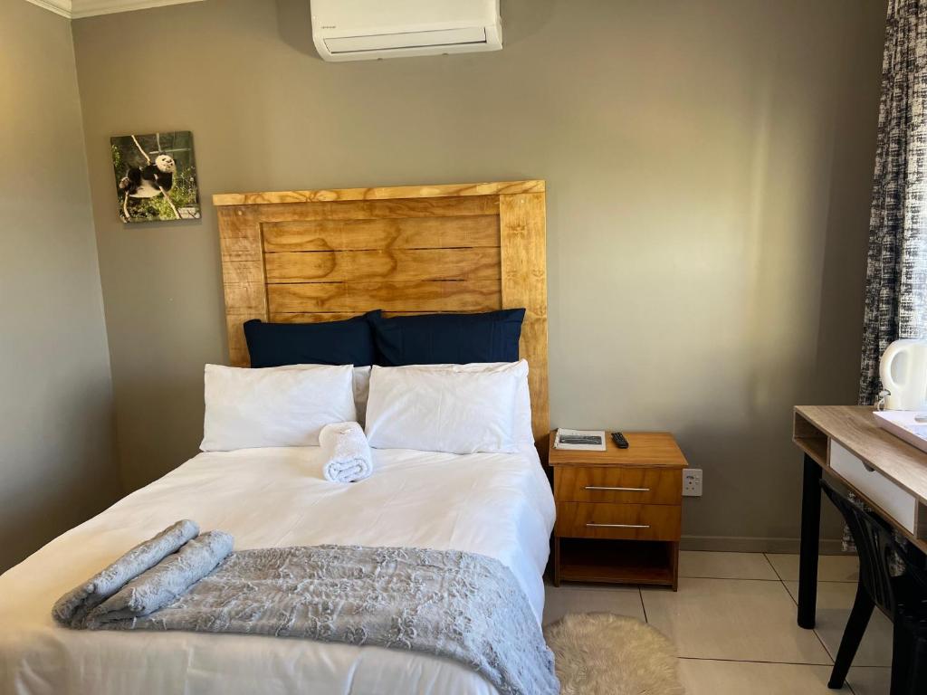 Una cama o camas en una habitación de La Vue