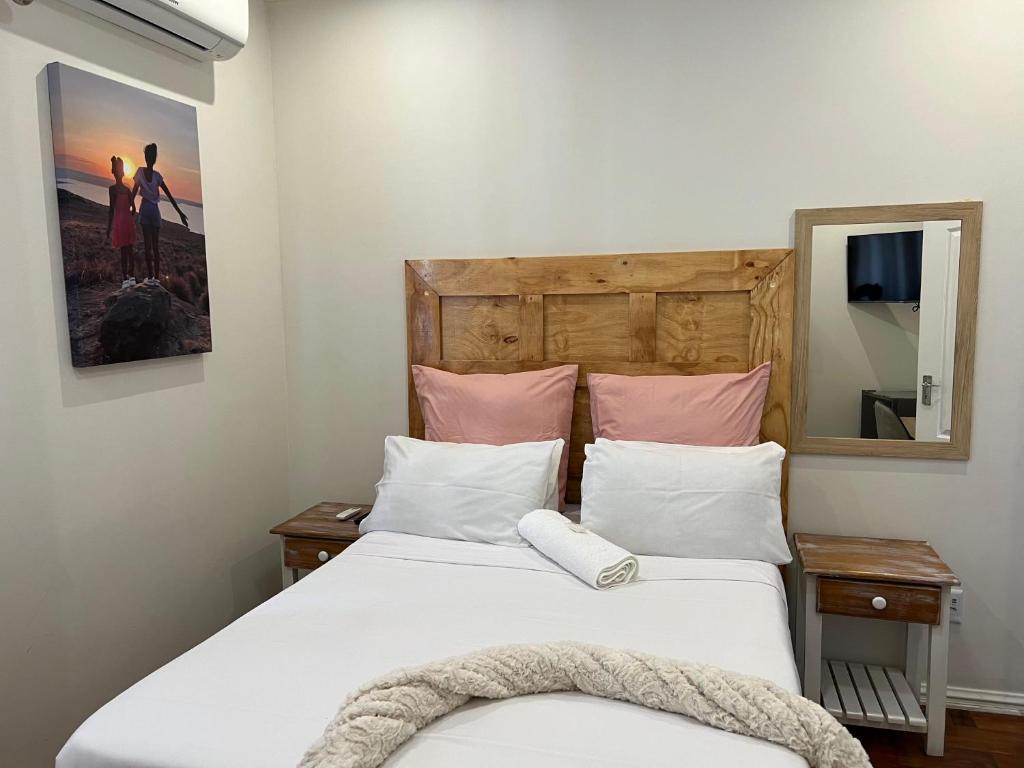 Una cama o camas en una habitación de La Vue