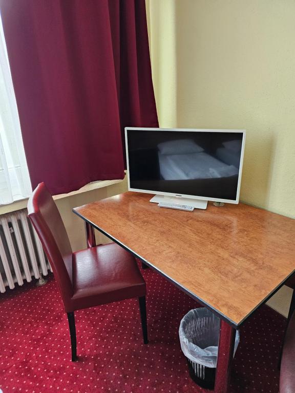 TV a/nebo společenská místnost v ubytování Domo Hotel Mondial